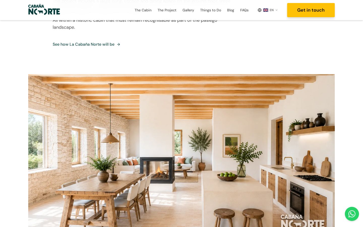 Interior de piedra y madera de La Cabaña Norte en la web